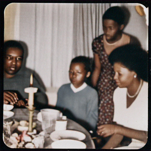 The Glow of Togetherness: A Birthday Celebration Captured in Warm Light