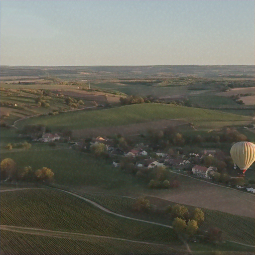 Tranquil Beauty: Hot Air Balloon Soars Over Picturesque Countryside