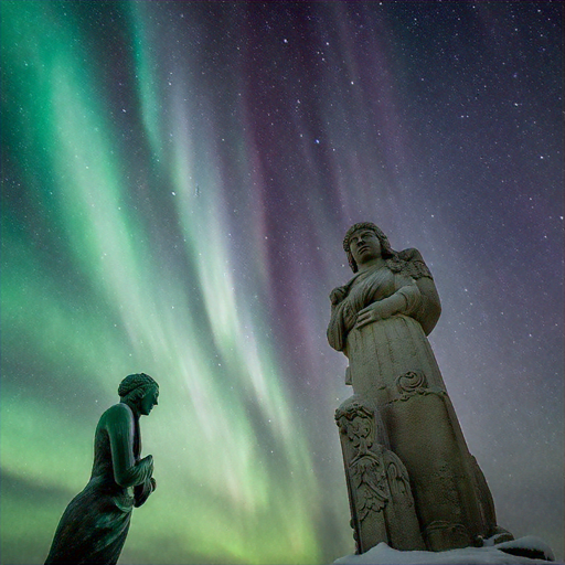 Celestial Guardians: Statues Silhouetted Against Vibrant Aurora Borealis