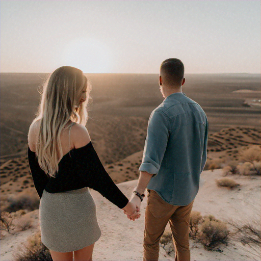 Love Amidst the Vastness: A Couple’s Intimate Moment Against a Dramatic Sunset