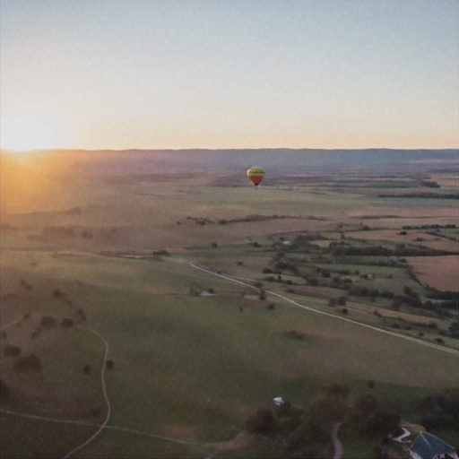 Sunset Serenity: A Hot Air Balloon Soars Over Rolling Hills